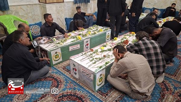 وداع با پیکر ۹ شهید پدافند سیراف در کنگان وداع با پیکر ۹ شهید پدافند سیراف در کنگان
