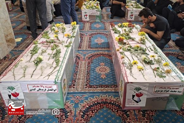 وداع با پیکر ۹ شهید پدافند سیراف در کنگان وداع با پیکر ۹ شهید پدافند سیراف در کنگان