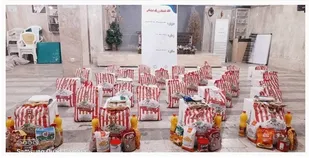 توزیع سبد کالا بین خانواده های کم برخوردار منطقه ۱۴