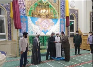 تجلیل  فرماندهی ناحیه کیش از خانواده  شهید مدافع سلامت