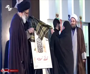 رونمایی از نشان آرمان روح الله و تقدیم آن به خانواده های معظم و معزز شهدا