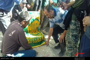 حضور خادمین رضوی بر مزار شهدای گمنام دشت میشان همدان