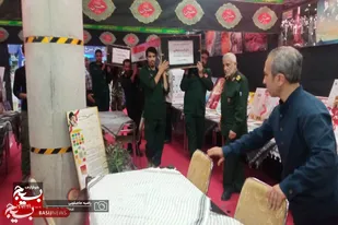 جای&zwnj;گذاری تابوت انتقال پیکر مطهر شهید سلیمانی در نمایشگاه بین المللی همدان